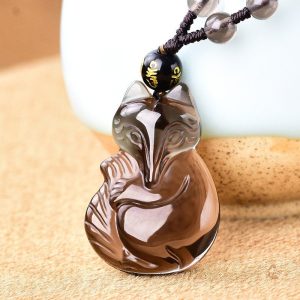Bijou en obsidienne avec motif de renard