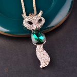 Bijou en forme de renard, émeraude scintillante
